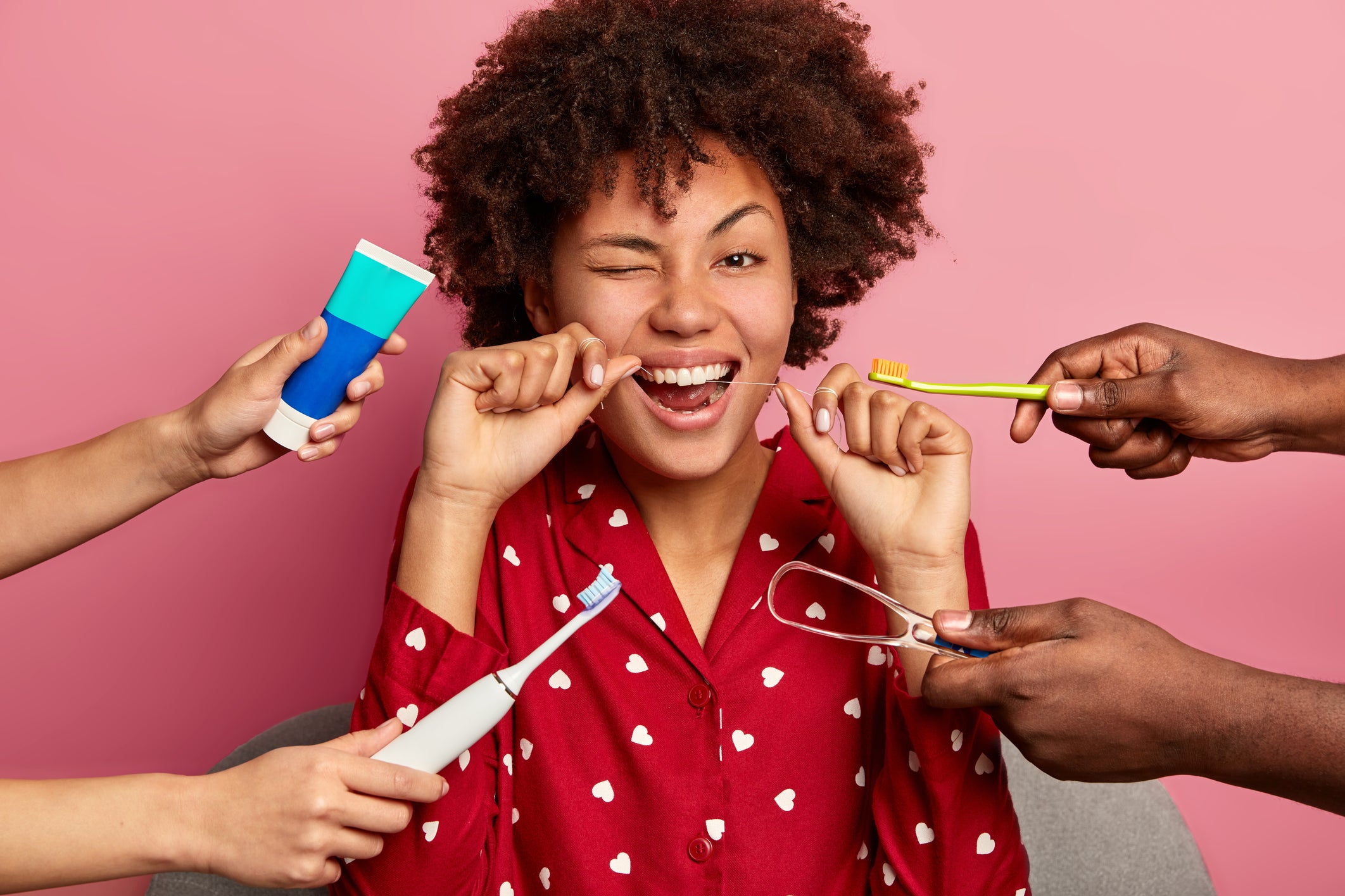 happy-curly-young-woman-brushes-teeth-with-tooth-f-2023-11-27-05-34-14-utc.jpg__PID:731292df-7b0f-4340-b6fb-05d935fcfa1b
